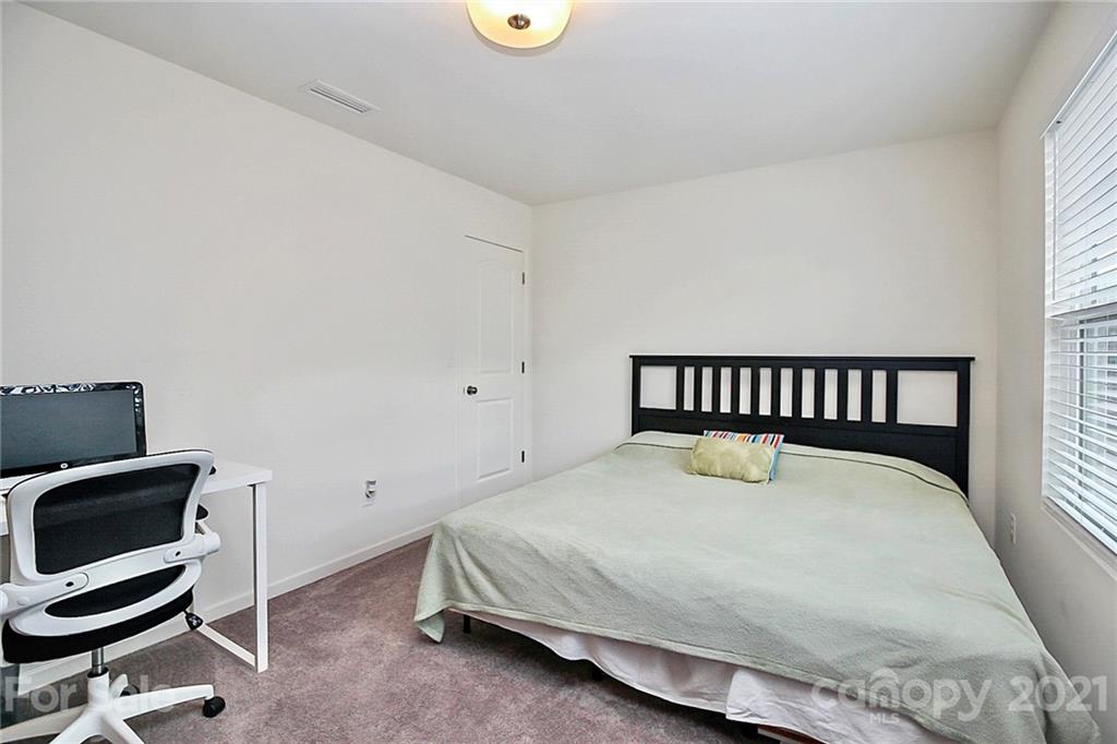 3034 Riker Street Clover, SC 29710 - Photo 32 of 42 a bed sitting in a room next to a window