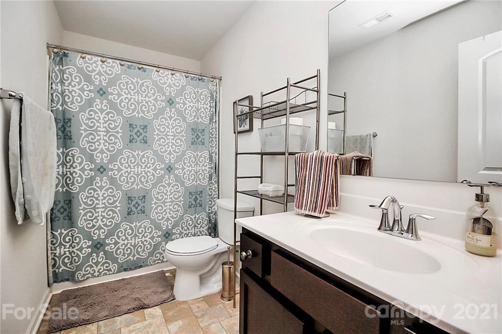 3034 Riker Street Clover, SC 29710 - Photo 33 of 42 a bathroom with a sink toilet and shower
