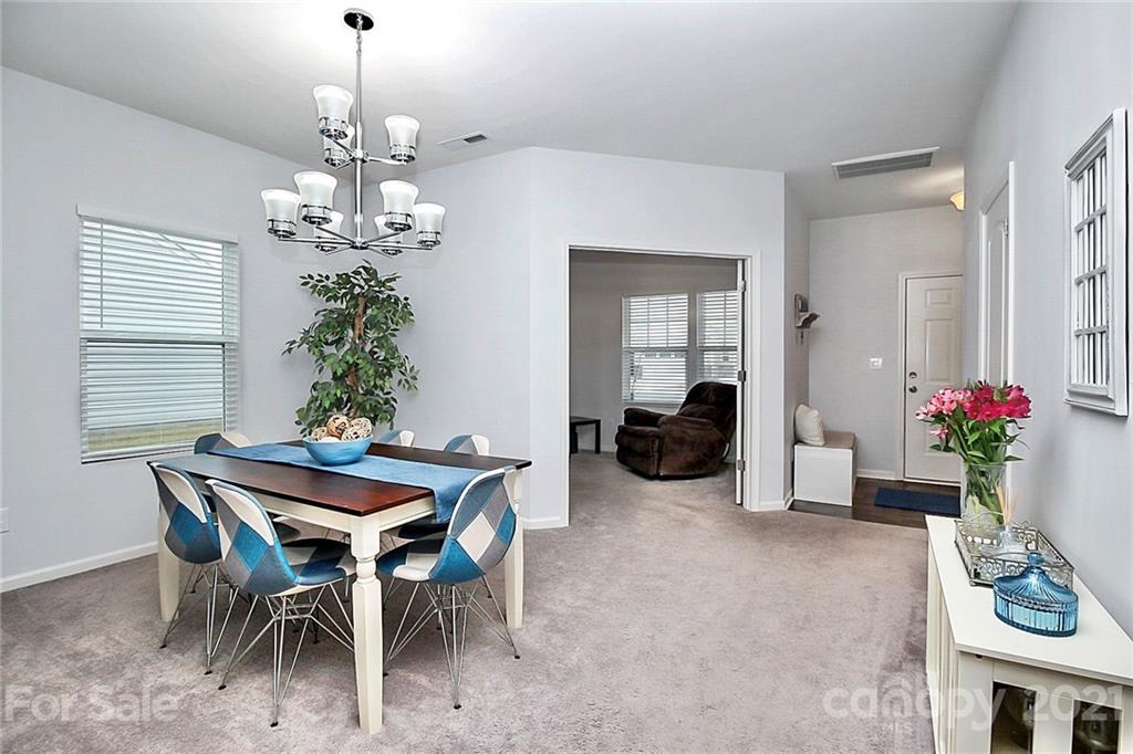 3034 Riker Street Clover, SC 29710 - Photo 8 of 42 a view of a dining room with furniture and chandelier