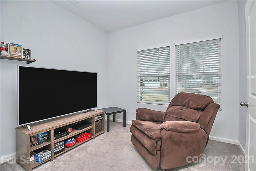 3034 Riker Street Clover, SC 29710 - Photo 9 of 42 a living room with furniture and a flat screen tv