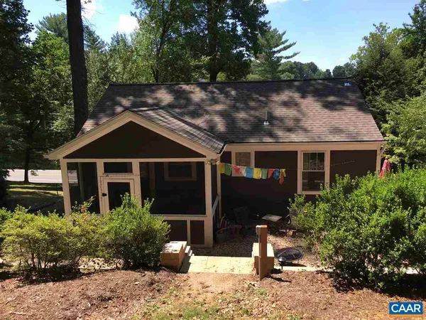 a kitchen with stainless steel appliances granite countertop a sink and a refrigerator