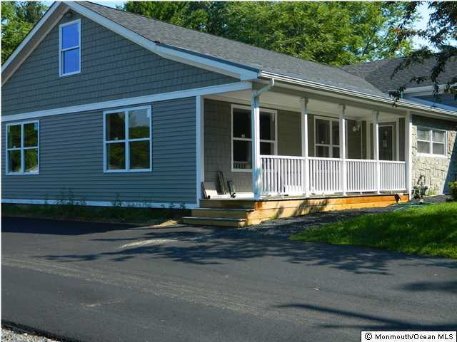 412 Georgia Tavern Road Howell, NJ 07731 - Photo 2 of 3 a view of a house with a small yard plants and large tree