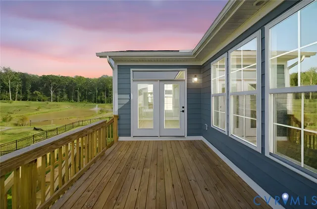 a view of balcony with floor to ceiling windows with wooden floor