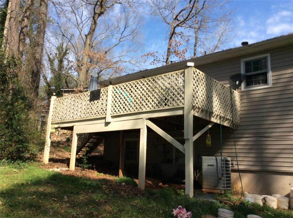 3122 Dempsey Place Lawrenceville, GA 30044 - Photo 2 of 2 a view of a house with a yard garage and outdoor seating