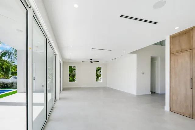 a bathroom with a granite countertop sink toilet a mirror and shower