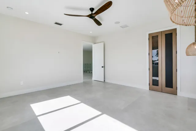 a view of room with window and ceiling fan