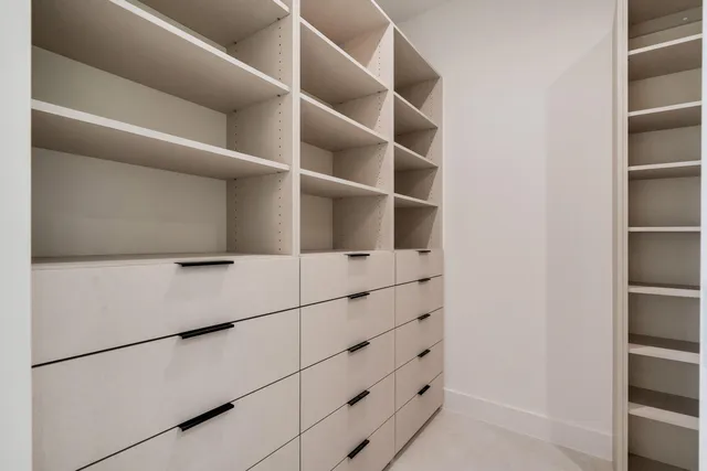 a bathroom with a shower a toilet and a sink