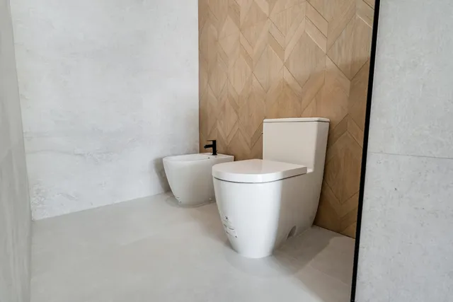 a room with lots of windows and white walls