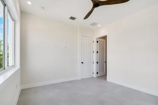 a view of balcony with wooden floor and fence