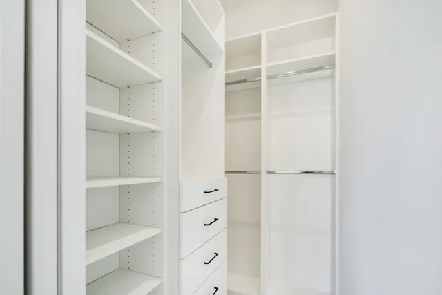 a view of a kitchen with a sink and a fireplace