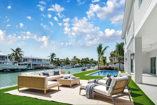 a bedroom with a bed a couch and a window