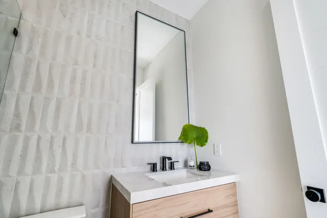 an aerial view of multiple houses with yard