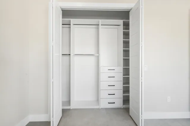 an aerial view of a city with lawn chairs