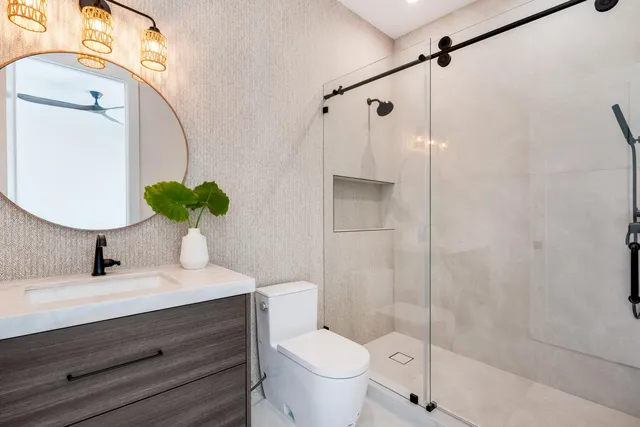 an aerial view of a house with swimming pool and a yard