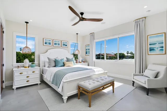 a spacious bedroom with a bed and a couch