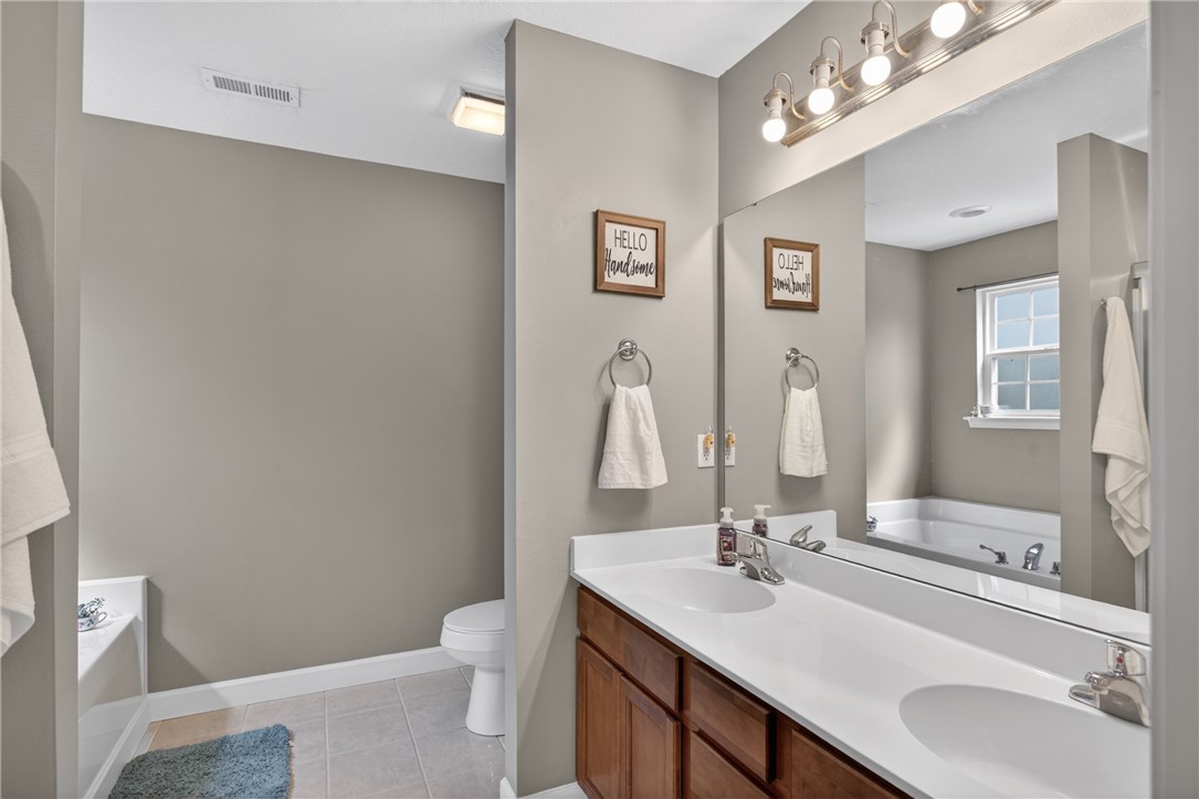 151 Towne Creek Trail Anderson, SC 29621 - Photo 18 of 49 Double vanity and a deep soaking tub create a restful bathroom retreat.