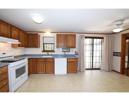 125 Sandy Valley Road Barnstable, MA 02648 - Photo 7 of 25 a kitchen with granite countertop a stove top oven sink and cabinets