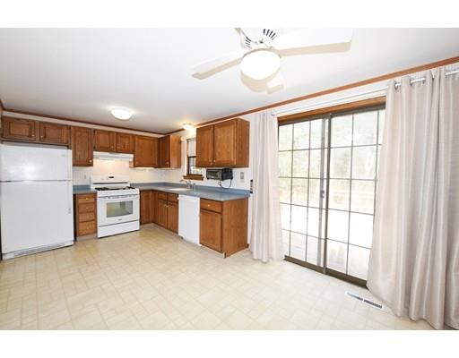 125 Sandy Valley Road Barnstable, MA 02648 - Photo 8 of 25 a kitchen with a refrigerator a stove top oven a sink and a window