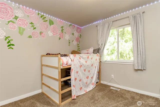 a bed room with a bed and a window