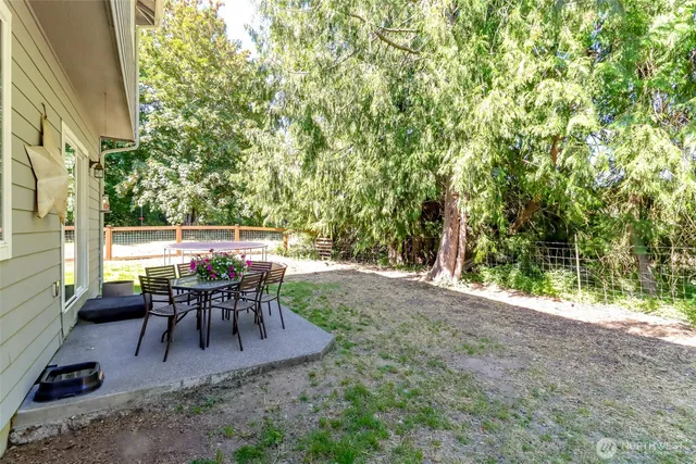 a view of a house with a yard porch and sitting area