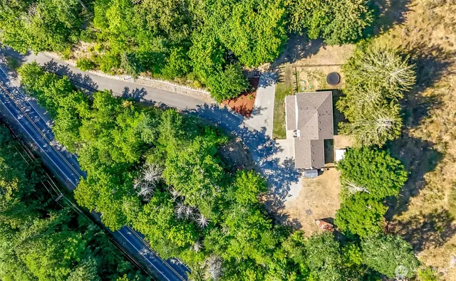 a view of a house with a tree