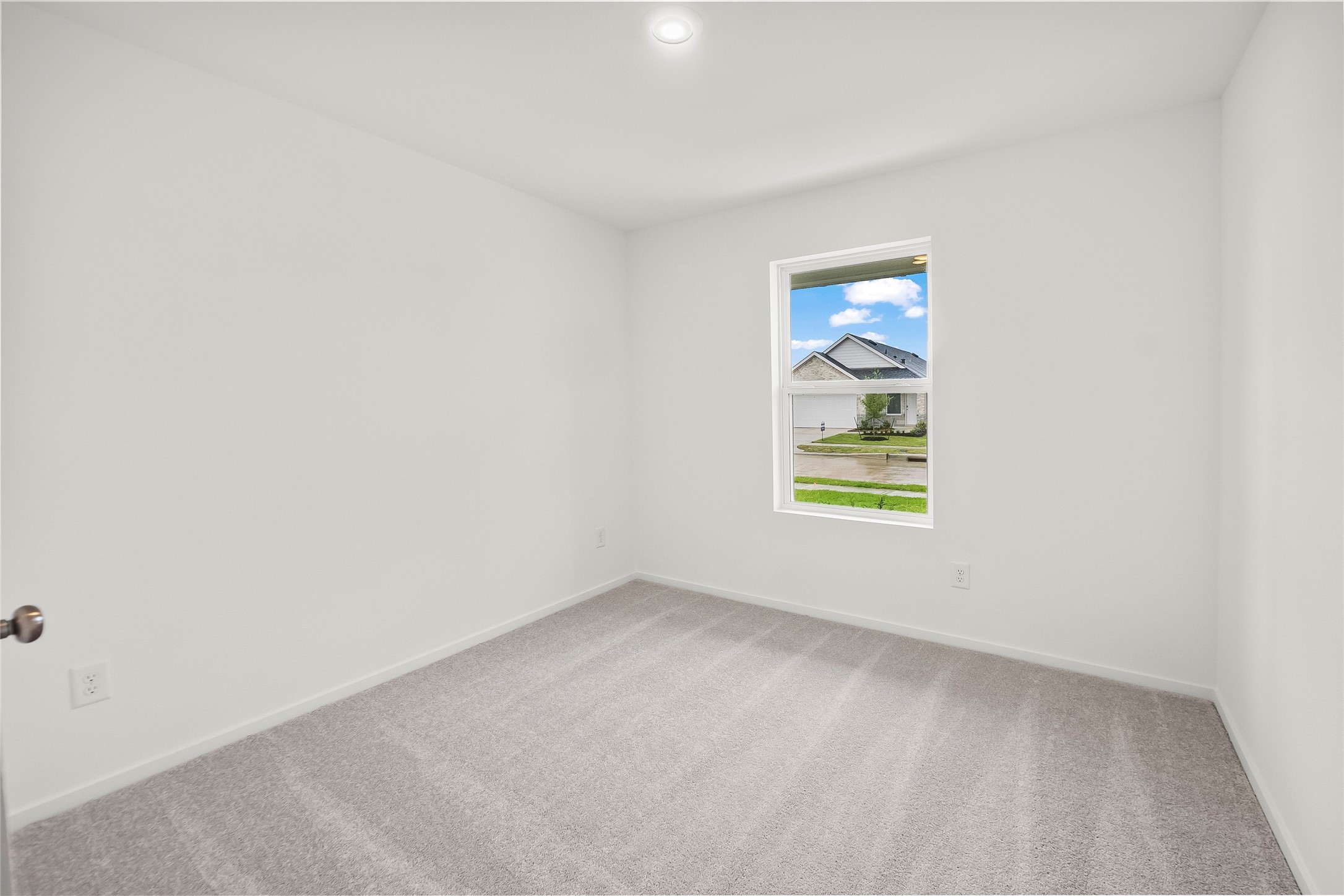 16102 Hatton Drive Conroe, TX 77303 - Photo 7 of 28 an empty room with windows