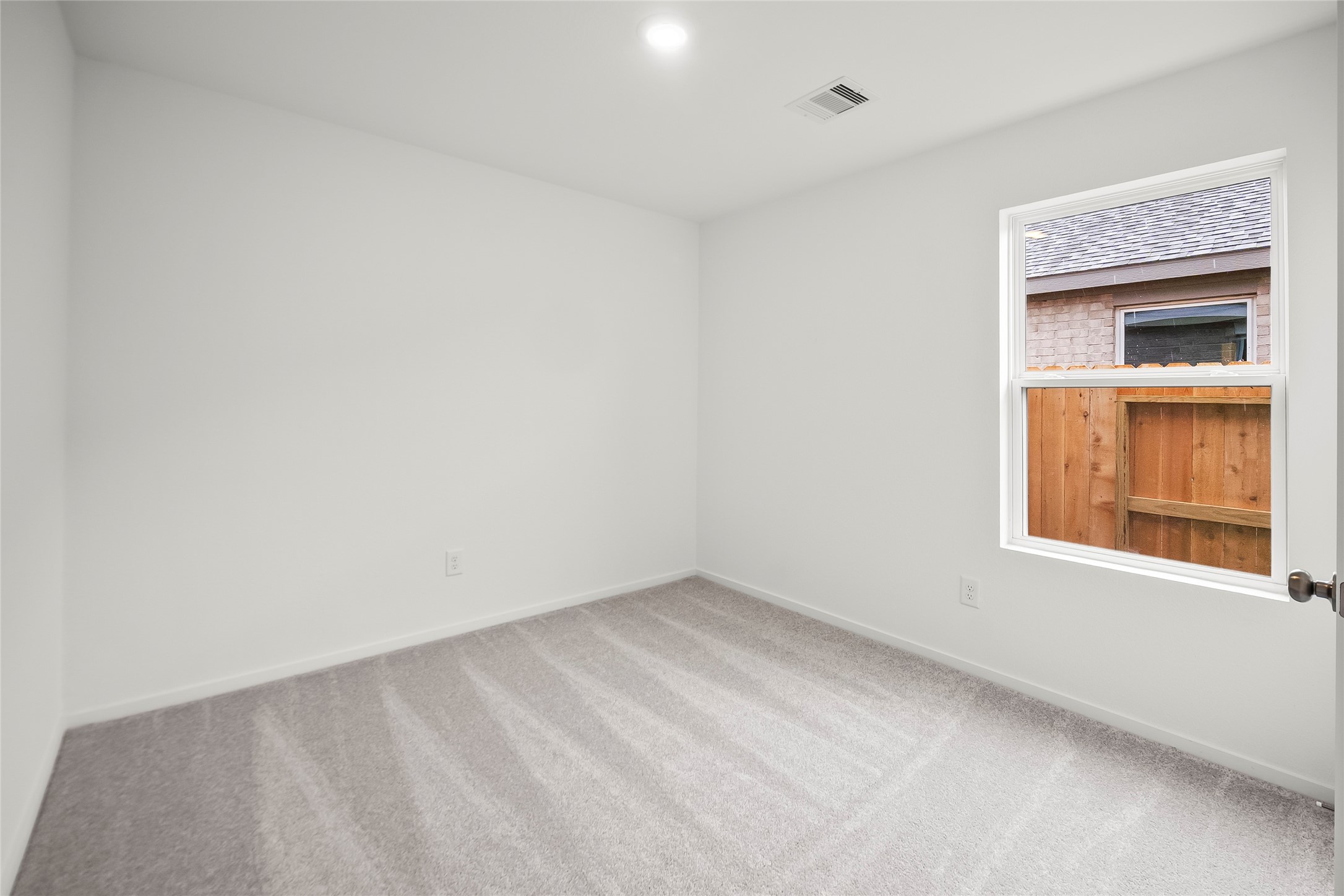 16102 Hatton Drive Conroe, TX 77303 - Photo 8 of 28 a view of an empty room and window