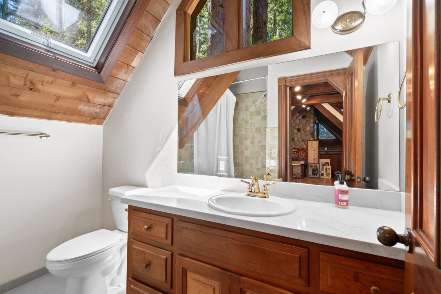 4611 Bonny Doon Road Santa Cruz, CA 95060 - Photo 17 of 94 a bathroom with a sink and a toilet