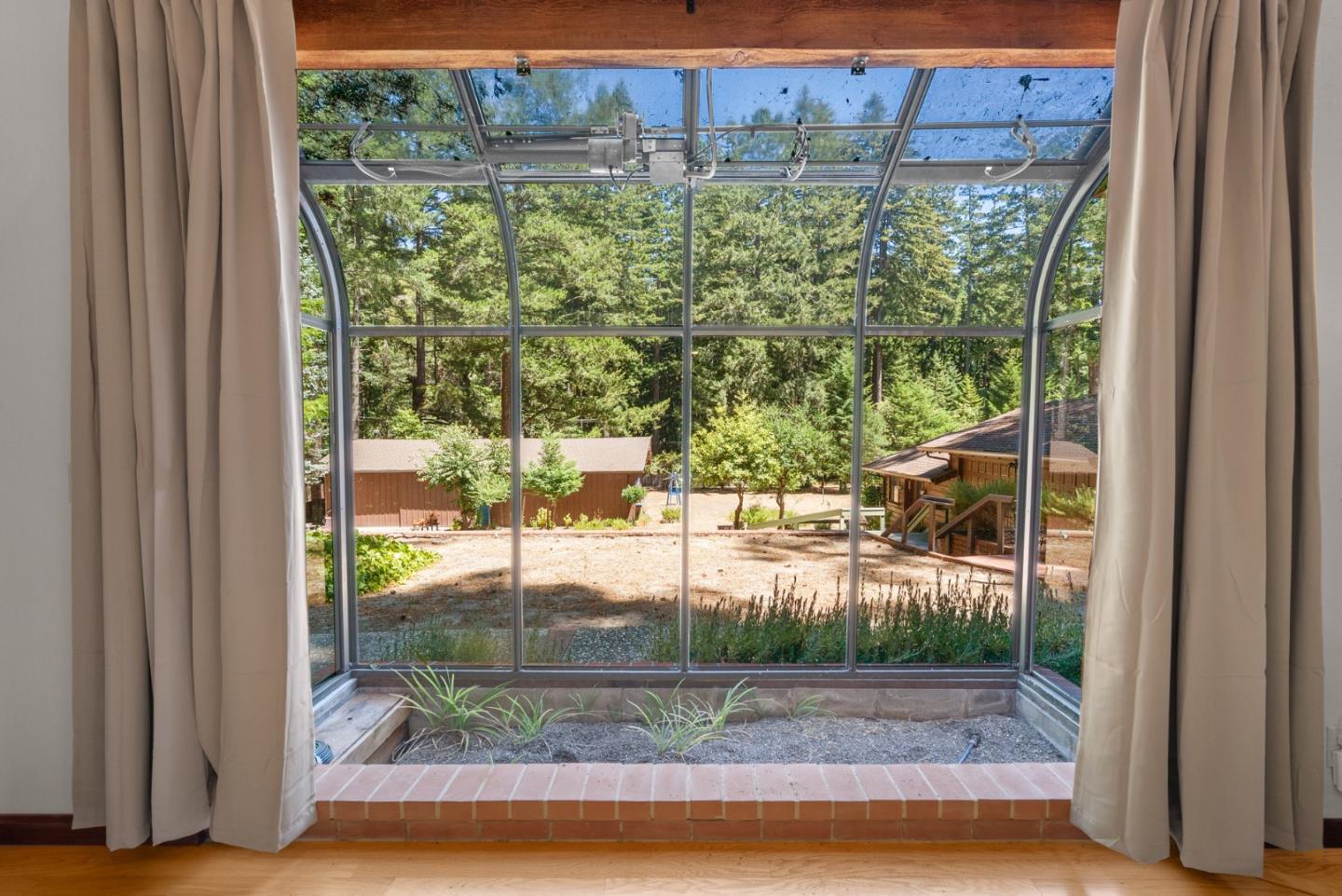 4611 Bonny Doon Road Santa Cruz, CA 95060 - Photo 19 of 94 a view of a yard from a window
