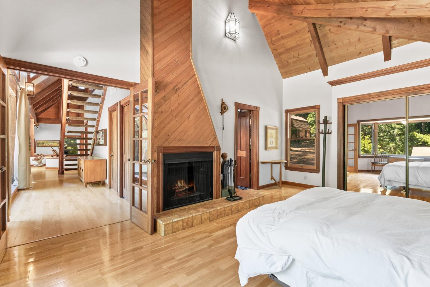 4611 Bonny Doon Road Santa Cruz, CA 95060 - Photo 20 of 94 a spacious bedroom with a bed and a large window