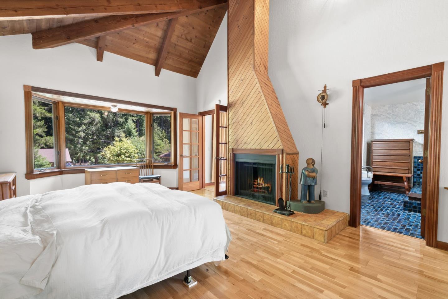 4611 Bonny Doon Road Santa Cruz, CA 95060 - Photo 21 of 94 a large white bed in a room next to a window