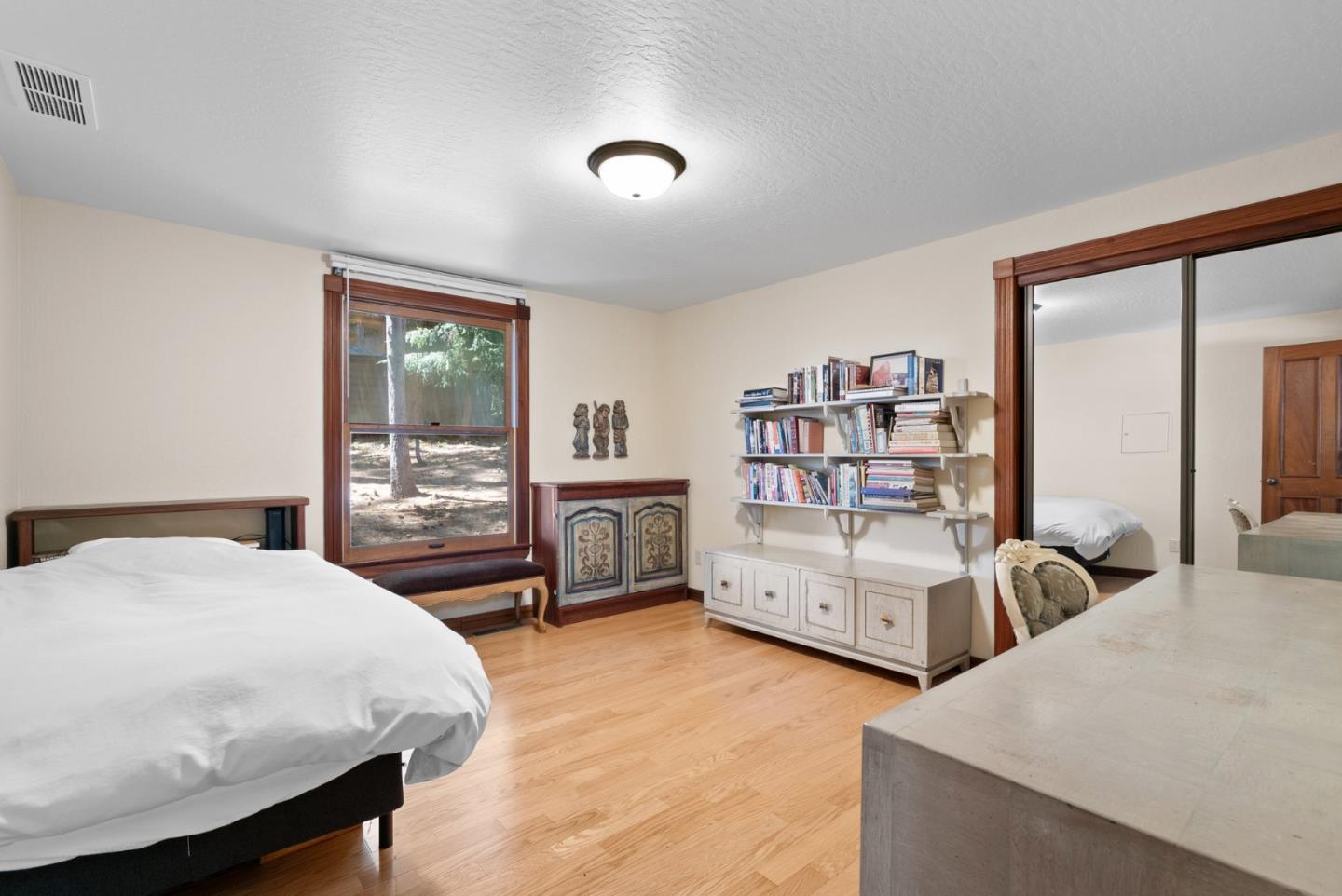 4611 Bonny Doon Road Santa Cruz, CA 95060 - Photo 25 of 94 a living room with furniture and a flat screen tv