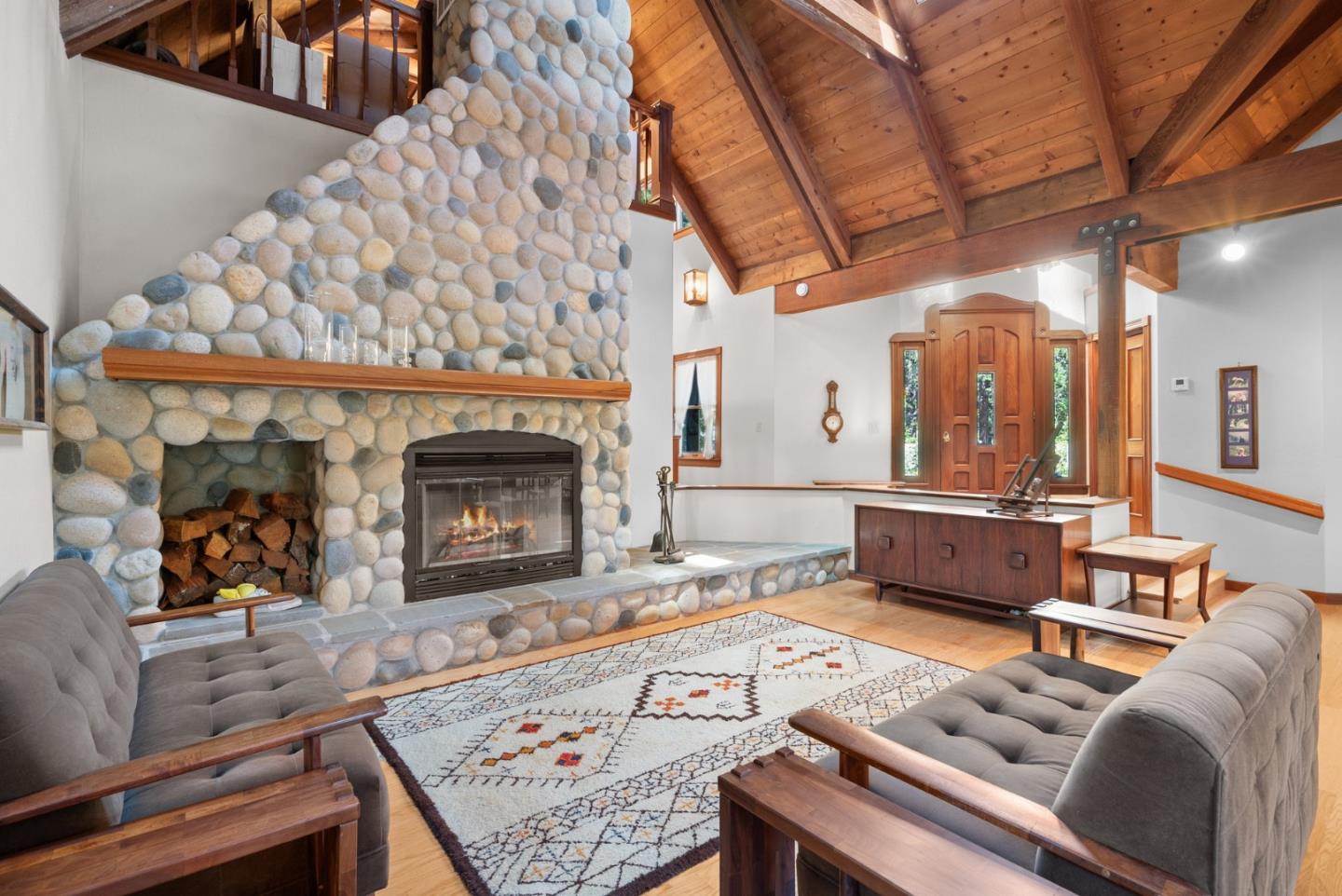 4611 Bonny Doon Road Santa Cruz, CA 95060 - Photo 3 of 94 a living room with furniture and a fireplace