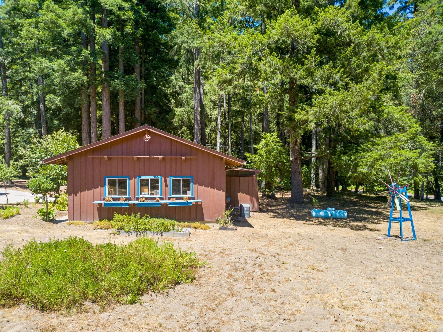4611 Bonny Doon Road Santa Cruz, CA 95060 - Photo 42 of 94 a front view of a house with a yard