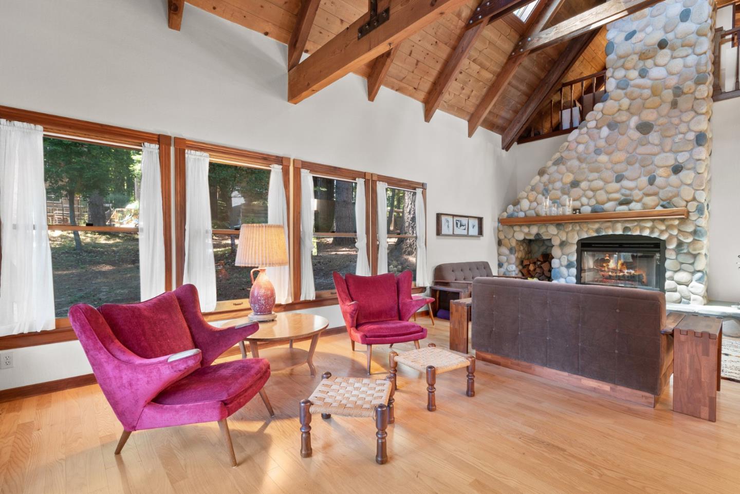 4611 Bonny Doon Road Santa Cruz, CA 95060 - Photo 52 of 94 a living room with furniture a flat screen tv and a fireplace
