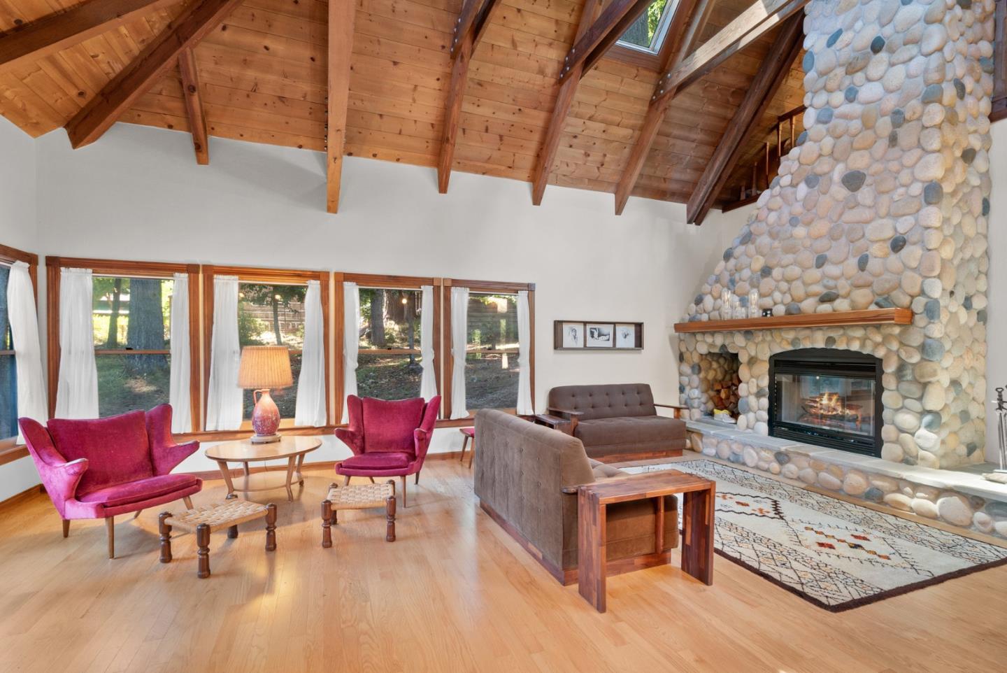 4611 Bonny Doon Road Santa Cruz, CA 95060 - Photo 55 of 94 a living room with furniture and a fireplace