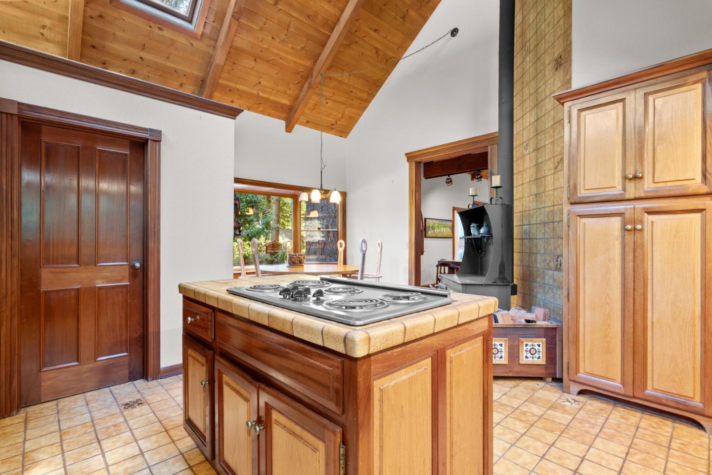 4611 Bonny Doon Road Santa Cruz, CA 95060 - Photo 60 of 94 a kitchen that has a stove and a table in it