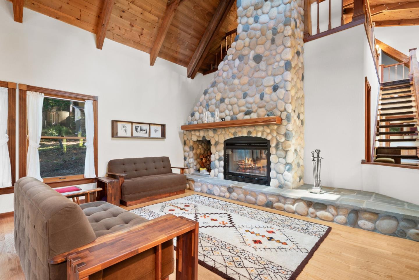 4611 Bonny Doon Road Santa Cruz, CA 95060 - Photo 6 of 94 a living room with furniture and a fireplace