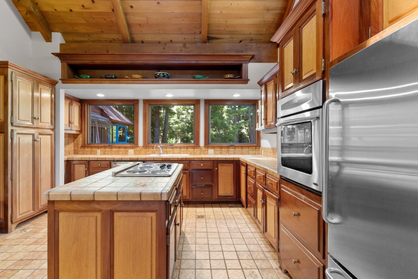 4611 Bonny Doon Road Santa Cruz, CA 95060 - Photo 62 of 94 a kitchen that has a stove and a refrigerator