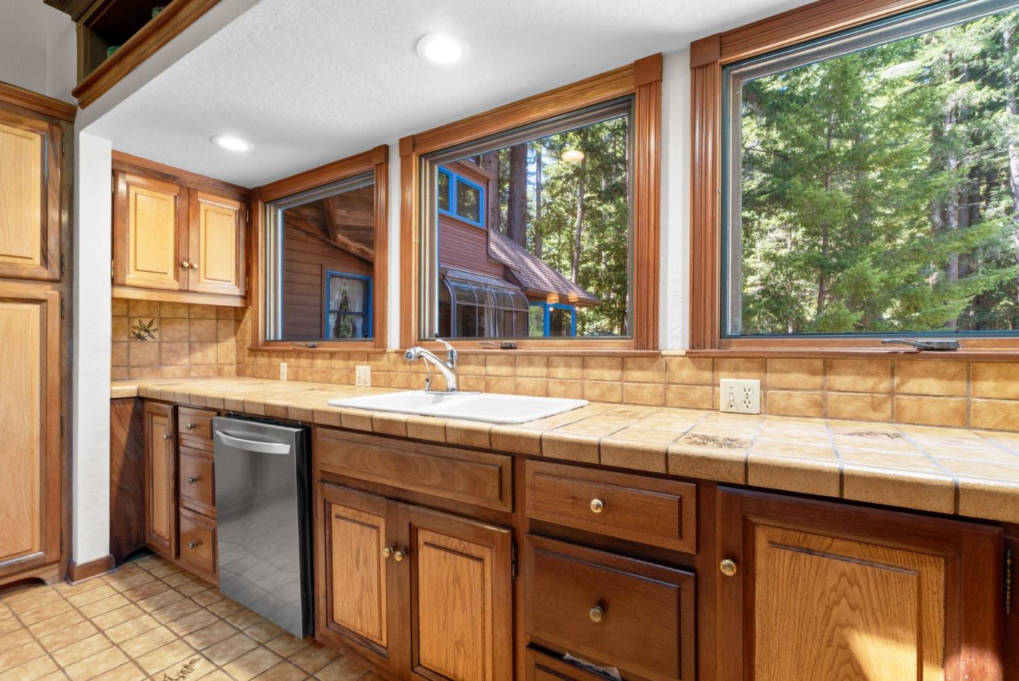 4611 Bonny Doon Road Santa Cruz, CA 95060 - Photo 63 of 94 a kitchen with granite countertop a sink and a window