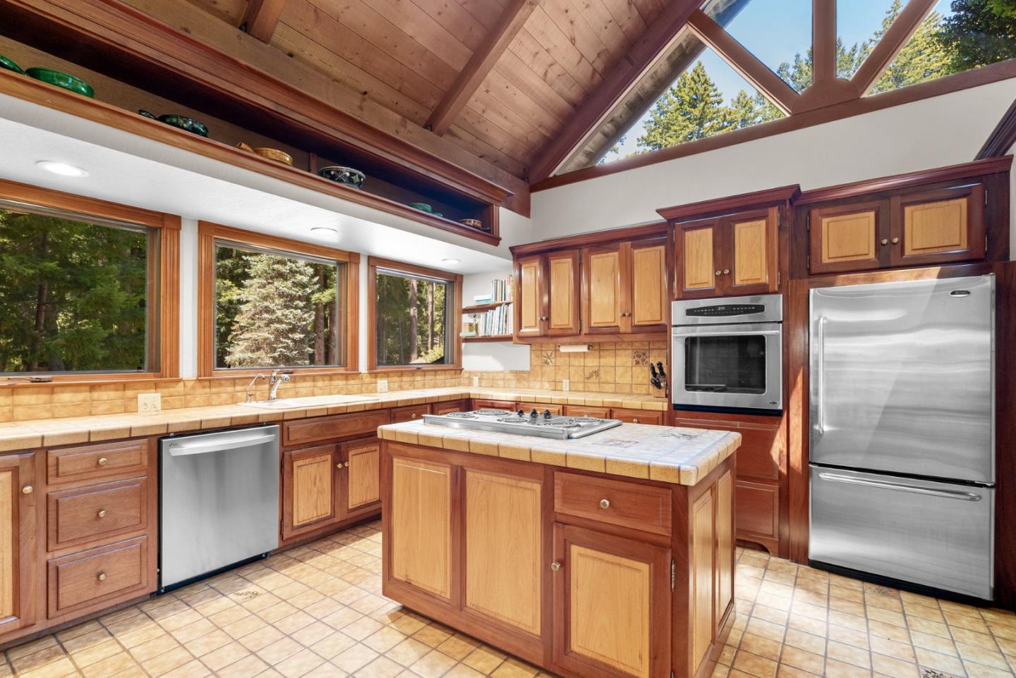 4611 Bonny Doon Road Santa Cruz, CA 95060 - Photo 64 of 94 a kitchen with a stove a sink and a refrigerator