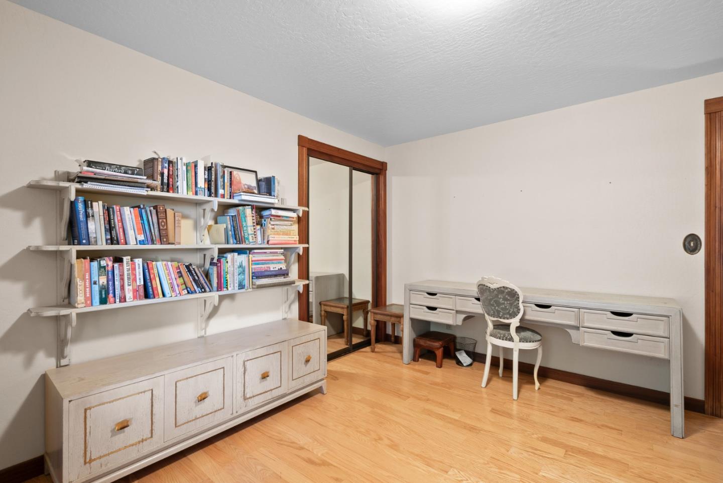 4611 Bonny Doon Road Santa Cruz, CA 95060 - Photo 75 of 94 a view of a workspace with furniture and a bookshelf