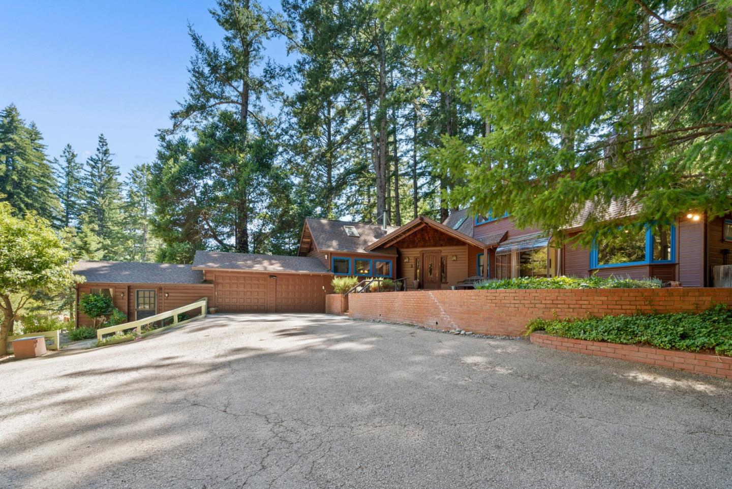 4611 Bonny Doon Road Santa Cruz, CA 95060 - Photo 76 of 94 a view of a house with a yard and large tree