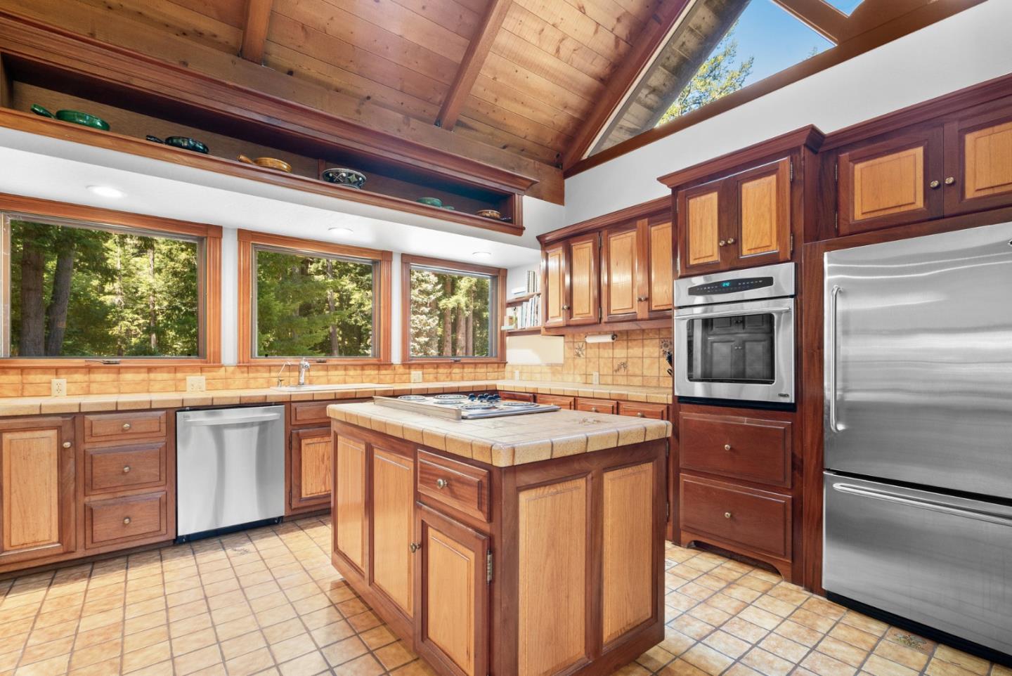 4611 Bonny Doon Road Santa Cruz, CA 95060 - Photo 9 of 94 a kitchen with stainless steel appliances granite countertop a stove a sink and a refrigerator