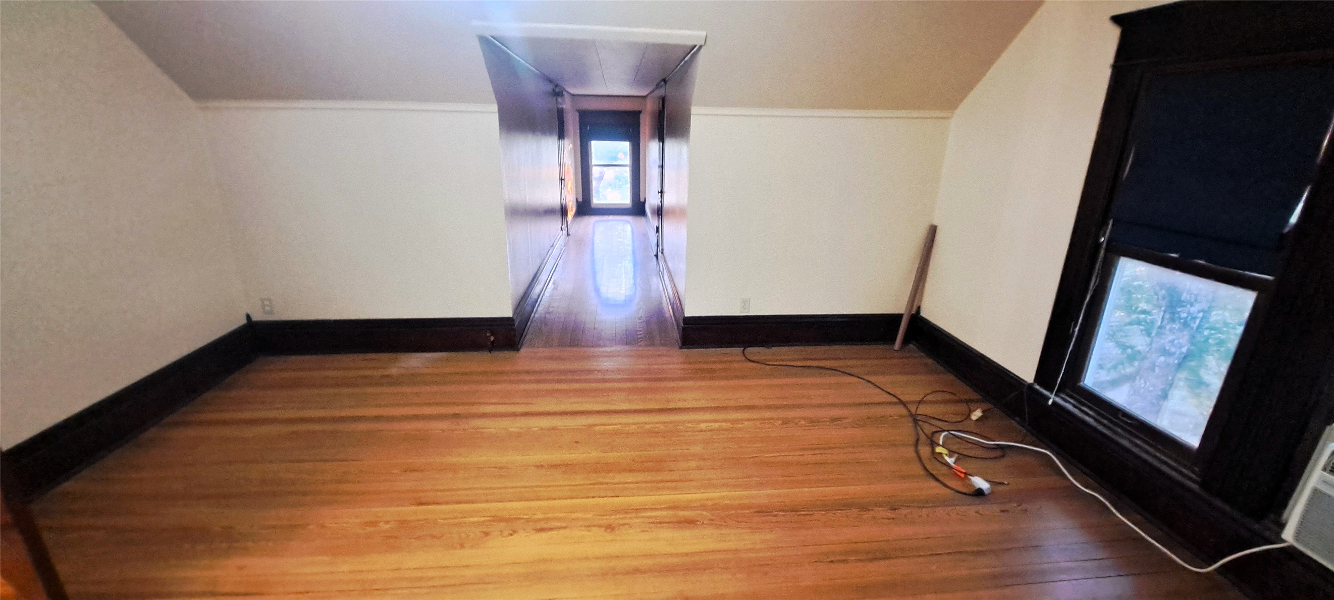 105 Davis Drive Thorndale, TX 76577 - Photo 11 of 21 Gleaming hardwood floors and classic dark trim define this versatile upper-level space.
