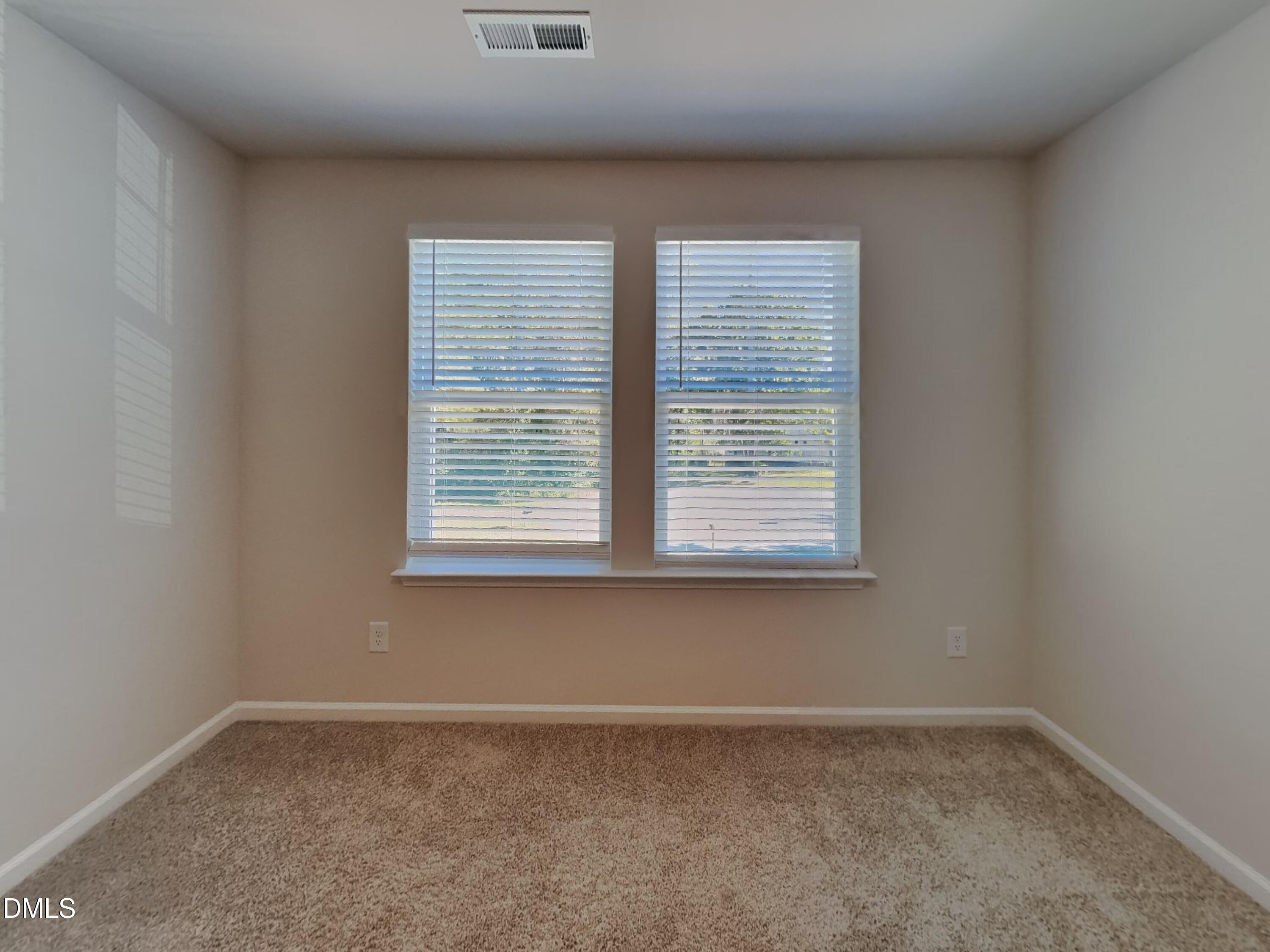 35 Drake Circle Bunnlevel, NC 28323 - Photo 11 of 17 an empty room with a window