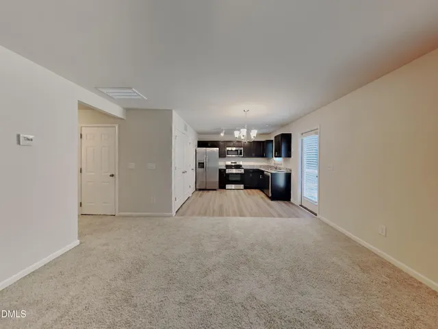 a view of kitchen with furniture and cabinet