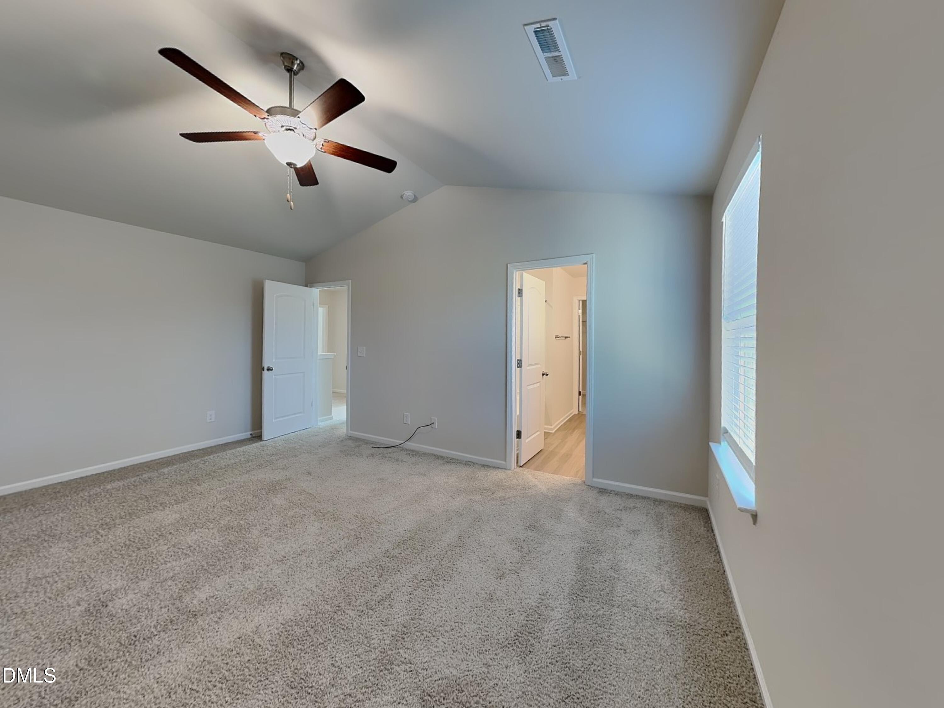 35 Drake Circle Bunnlevel, NC 28323 - Photo 5 of 17 an empty room with closet and a chandelier fan