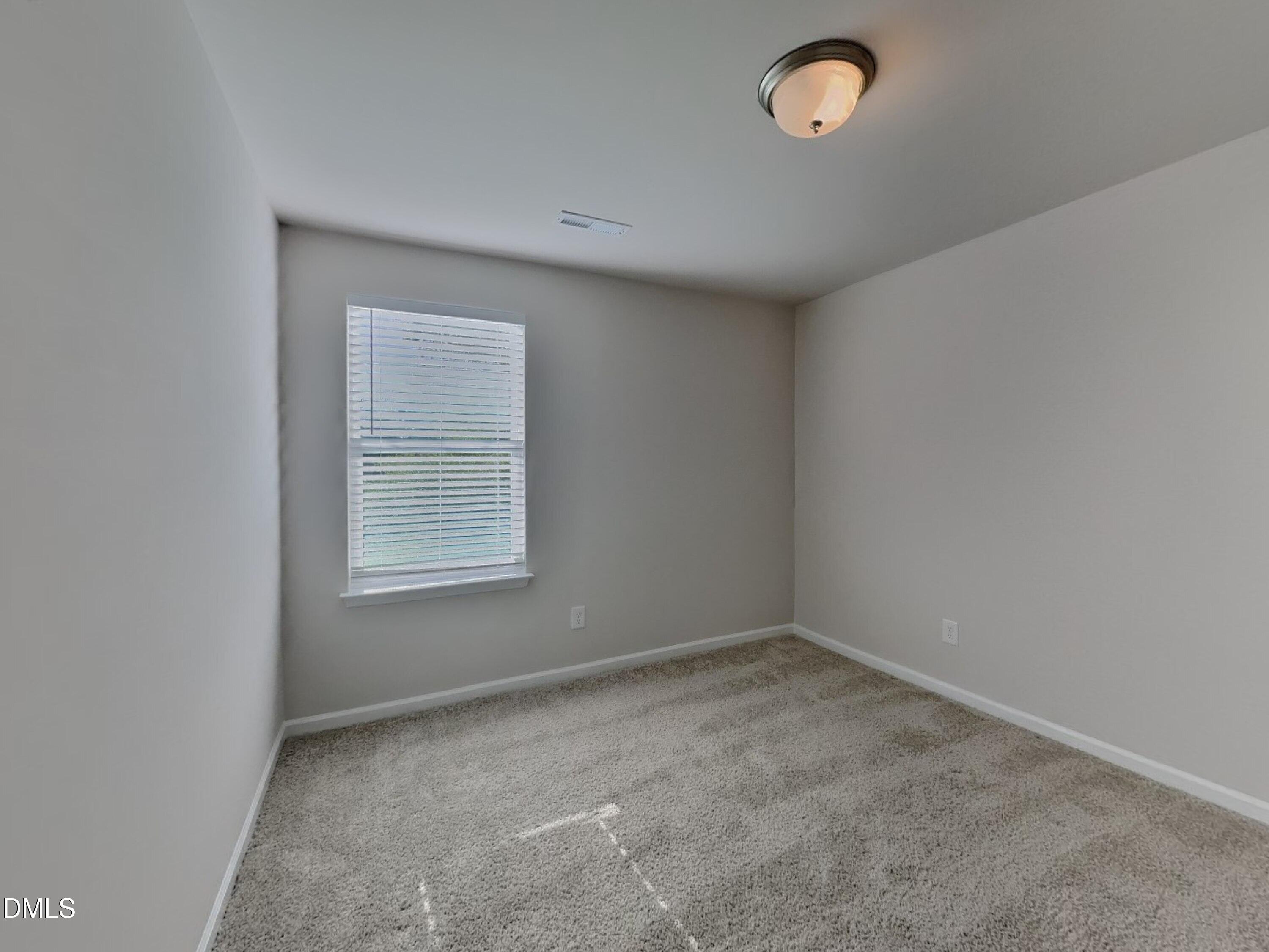 35 Drake Circle Bunnlevel, NC 28323 - Photo 9 of 17 an empty room with a window
