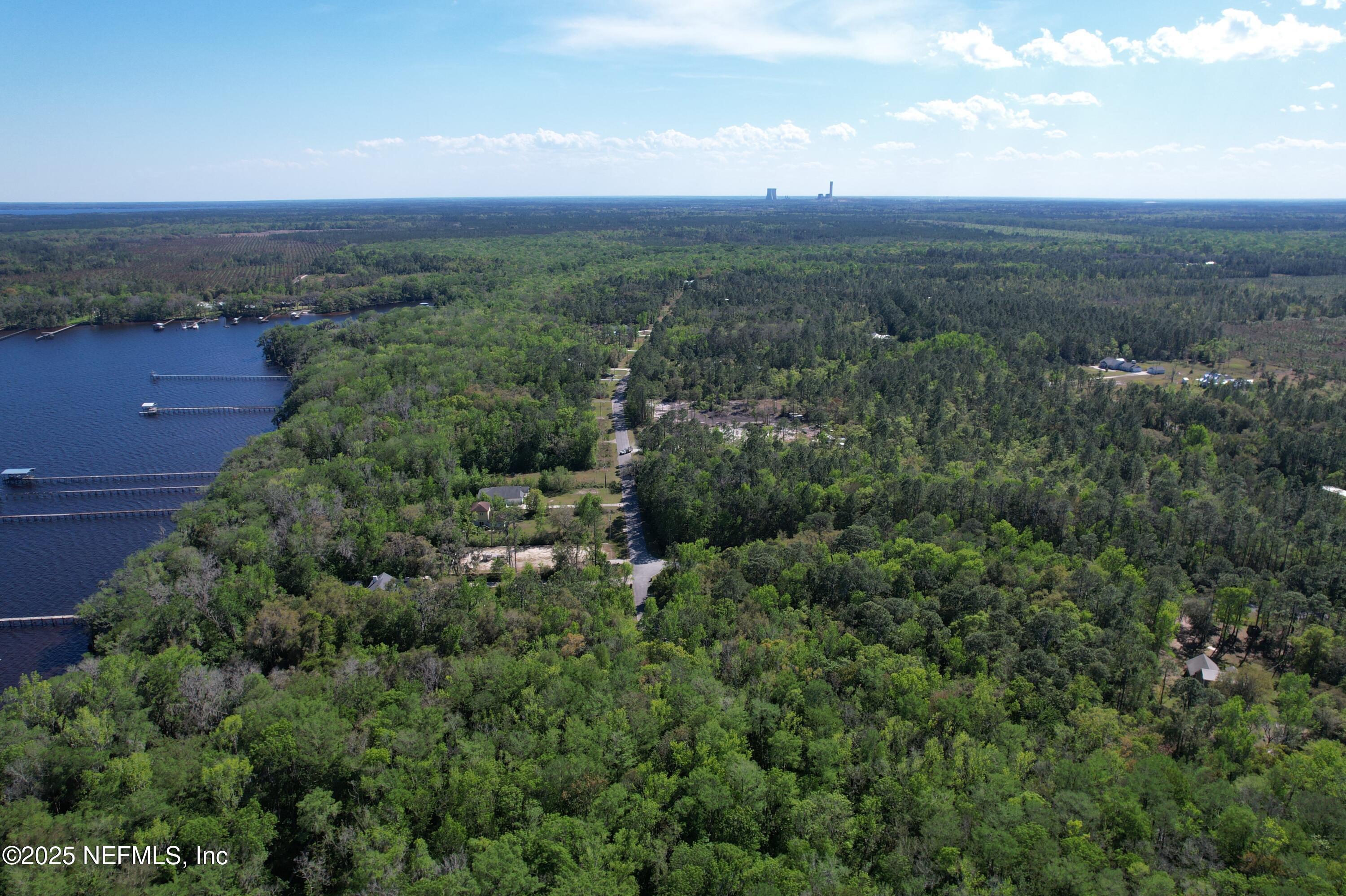0 Cedar Creek Road Green Cove Springs, FL 32043 - Photo 4 of 10 an aerial view of residential houses with outdoor space and trees